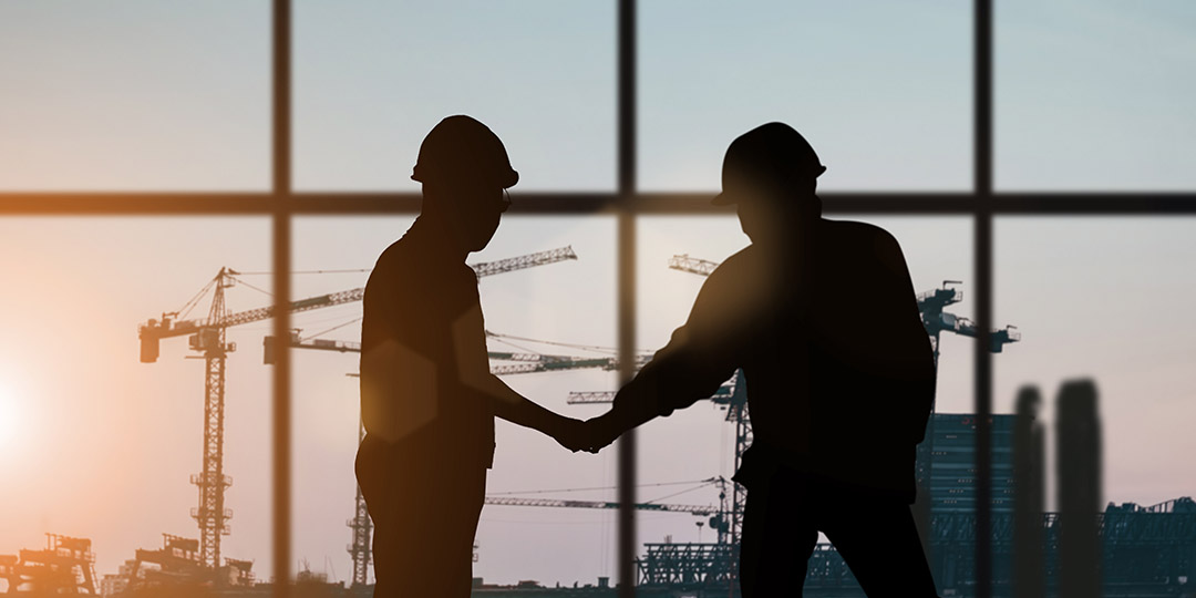 two persons shakes hand